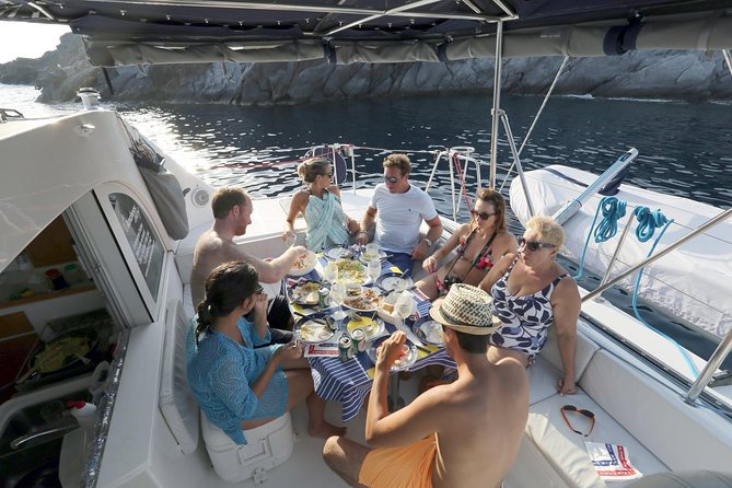 Santorini Half Day Catamaran Private Cruise incl. Meal, Drinks & Free Transport - Faros Lighthouse: the far-south viewpoint you don’t get from town