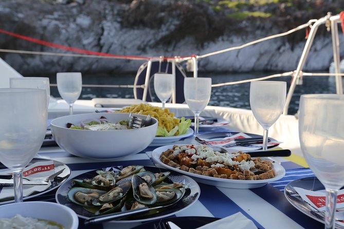 Santorini Half Day Catamaran Private Cruise incl. Meal, Drinks & Free Transport - Aspronisi (Strogili) and the caldera islands: why the water makes sense