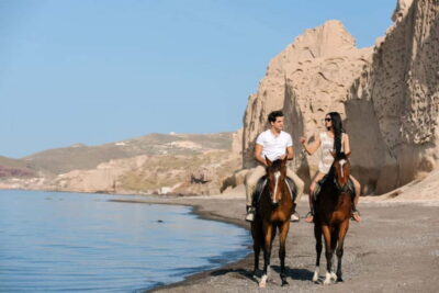 Santorini: Horseback Riding on the Black Sandy Eros Beach - Getting set up: helmets, saddle basics, and your short riding lesson