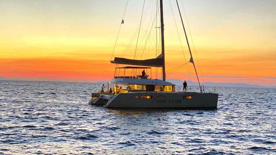 Santorini: Luxurious Catamaran Cruise with Meal & Open Bar - What the Crew and the Atmosphere Usually Feel Like
