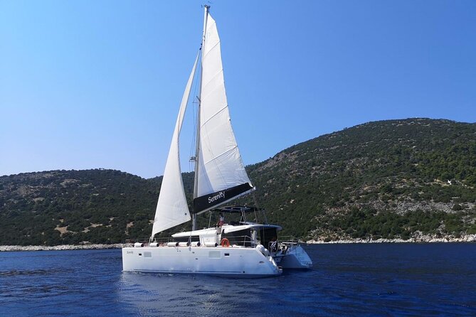 Santorini: Luxury Catamaran Cruise with Fresh Fish BBQ & Drinks - Mesa Pigadia: Black Sand, Clear Water, and a Real Swim Break