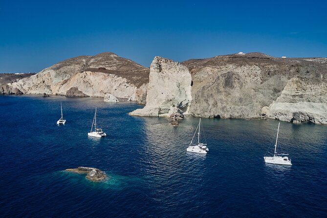 Santorini: Luxury Catamaran Cruise with Fresh Fish BBQ & Drinks - Enter Red Beach and the Volcanic Color Shift