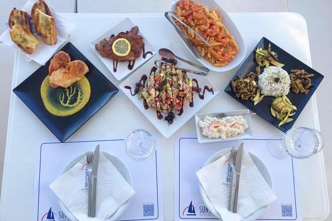 Santorini Luxury Catamaran Sunset Cruise with BBQ, Drink and Transfer - The 5-Hour Plan: Volcano Sailing, Lighthouse Views, and Swim Stops