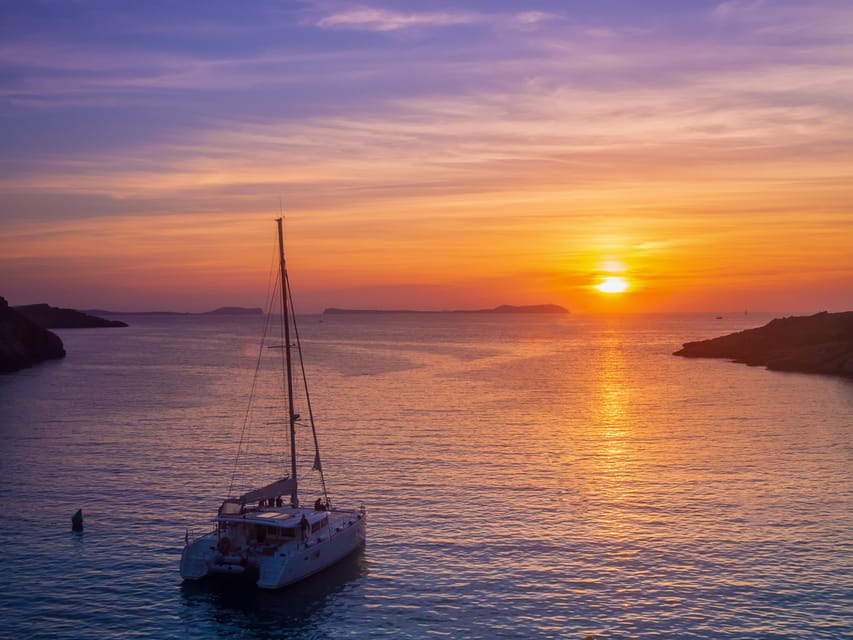 Santorini: Luxury Sunset Cruise with Dinner, BBQ, and Drinks - Palea Kameni hot springs: warm sulfur water with a clothing warning