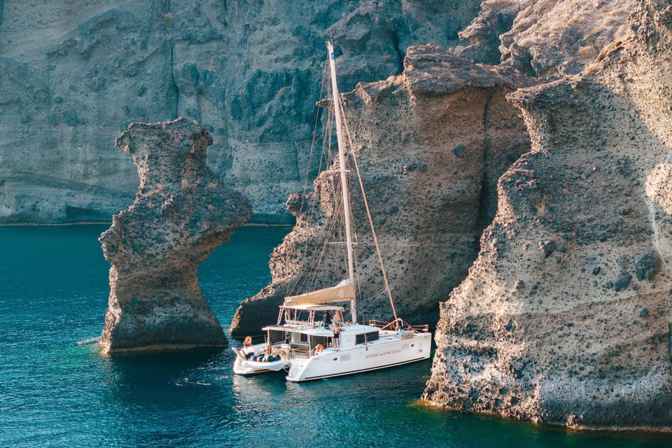 Santorini: Luxury Sunset Cruise with Dinner, BBQ, and Drinks - What to pack for a Santorini sunset catamaran (so you stay comfortable)