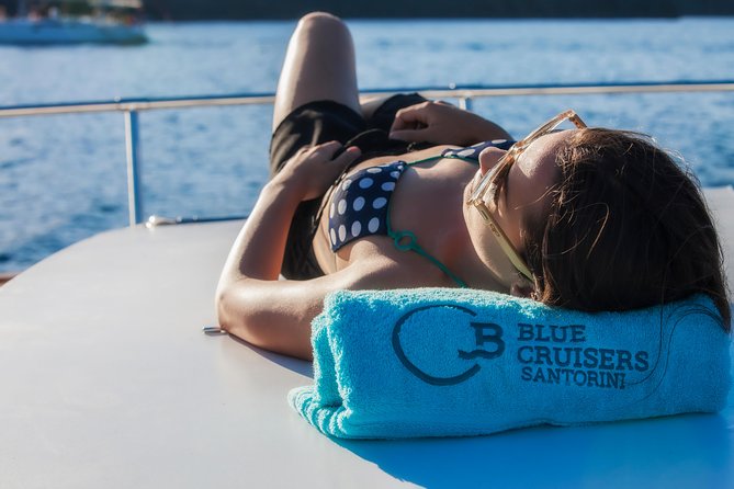 Santorini: Motor Yacht Sunset Cruise with 5-Course Dinner - Cruising the Caldera: from red and white beaches to the volcano zone