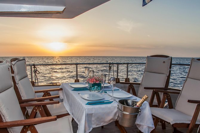 Santorini: Motor Yacht Sunset Cruise with 5-Course Dinner - The dinner moment: 5 courses, drinks included, and sunset reality checks