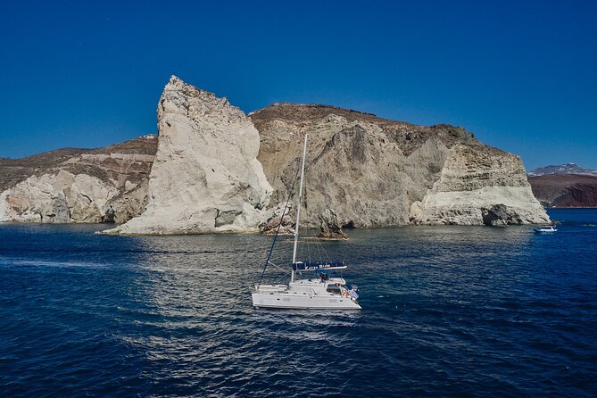 Santorini Oia: Luxury Sunset Cruise with Fresh Fish BBQ & Drinks - A small-group catamaran day that actually feels like Santorini