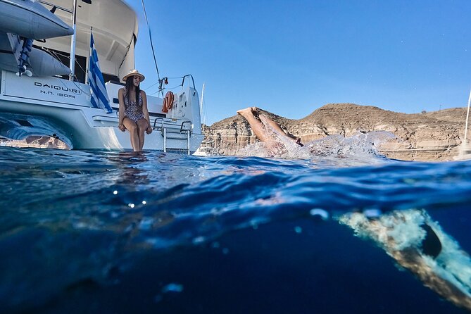 Santorini Oia: Luxury Sunset Cruise with Fresh Fish BBQ & Drinks - Quick port and lighthouse moments: why they’re short but useful