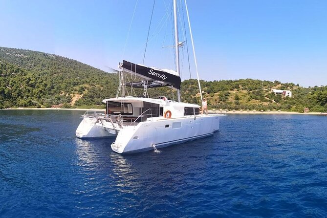 Santorini Oia: Private Sunset Catamaran Cruise with BBQ & Drinks - The lighthouse and old ports: where your sunset angles come from