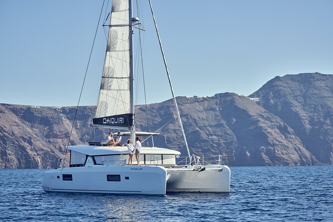 Santorini Oia: Private Sunset Catamaran Cruise with BBQ & Drinks - On-board comfort: BBQ dinner, unlimited drinks, and snorkeling gear