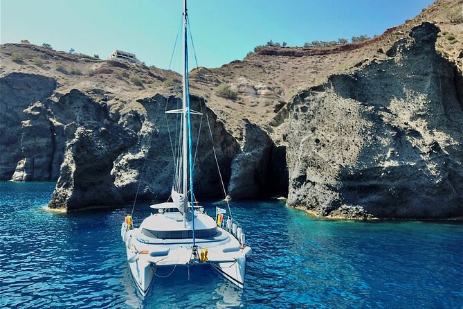 Santorini: Premium Small-Group Catamaran Cruise with Food/Drinks - How the day works onboard: group size, comfort, and safety rules