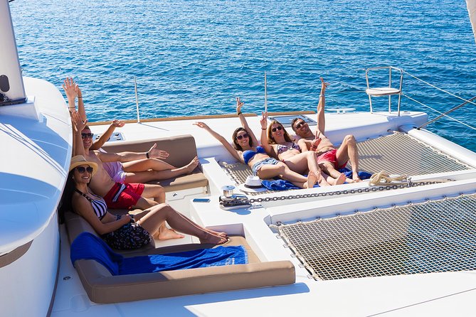 Santorini Private Catamaran Cruise with BBQ, Open Bar & Transfers - Indian Rocks and the Caldera Pass-By Moments
