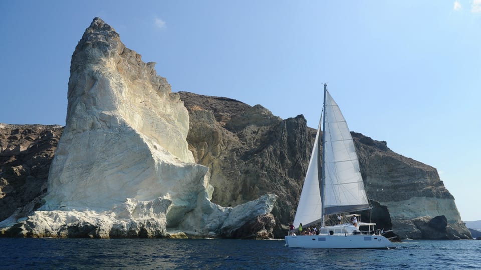 Santorini: Private Catamaran Tour with BBQ Meal and Drinks - Mesa Pigadia: Snorkeling Time Where the Rock Looks Alien