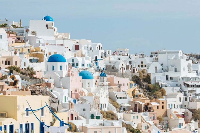 Santorini Private Half-Day Sightseeing Tour - Oia’s main street: blue domes, red-rock details, and a sunset mindset