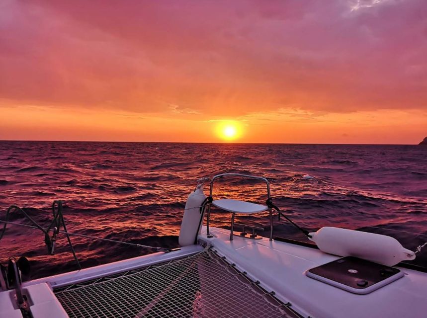 Santorini: Sunset Cruise with Greek Dinner and Transfer - Drinks included: beer, wine, soft drinks, and a relaxed pace
