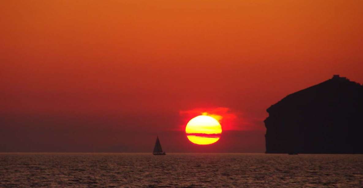 Santorini: Sunset Cruise with Greek Dinner and Transfer - Capturing the Santorini sunset: how the crew helps with photos