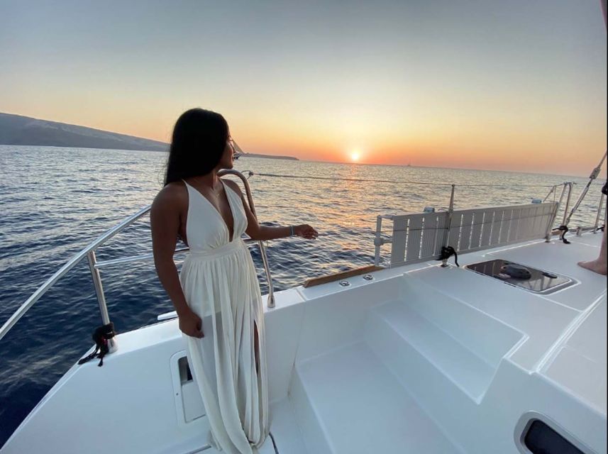 Santorini: Sunset Cruise with Greek Dinner and Transfer - The modern catamaran ride: caldera views without the hike