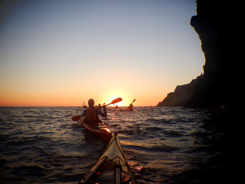Santorini: Sunset Sea Kayak with Light Dinner - Rock Formations, Caves, and the Black Mountain Sunset Moment