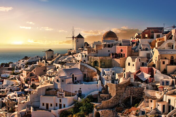 Santorini Sunset Walking Tour inc. tastings and 5 drinks - Three Bells of Fira: seafood dish, church photos, craft beer