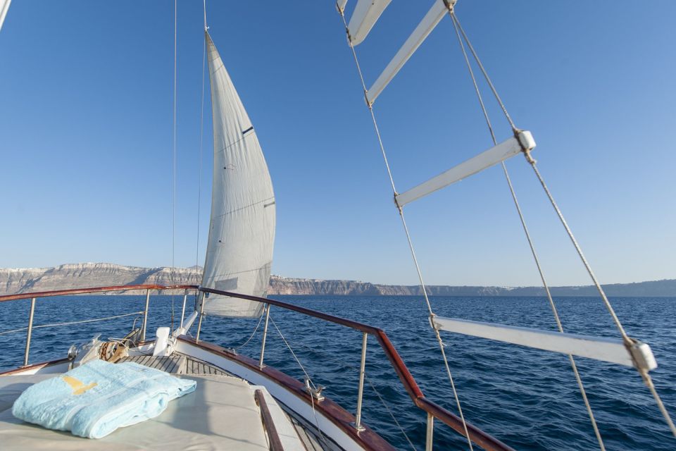 Santorini: Traditional Wooden Boat Tour with Meal and Wine - Volcanic Hot Springs: Swimming Where the Earth Turns Up the Heat