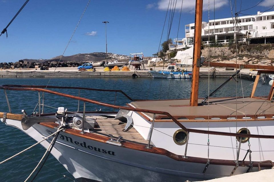 Santorini: Traditional Wooden Boat Tour with Meal and Wine - Lunch or Dinner with Local White Wine: What You Actually Get