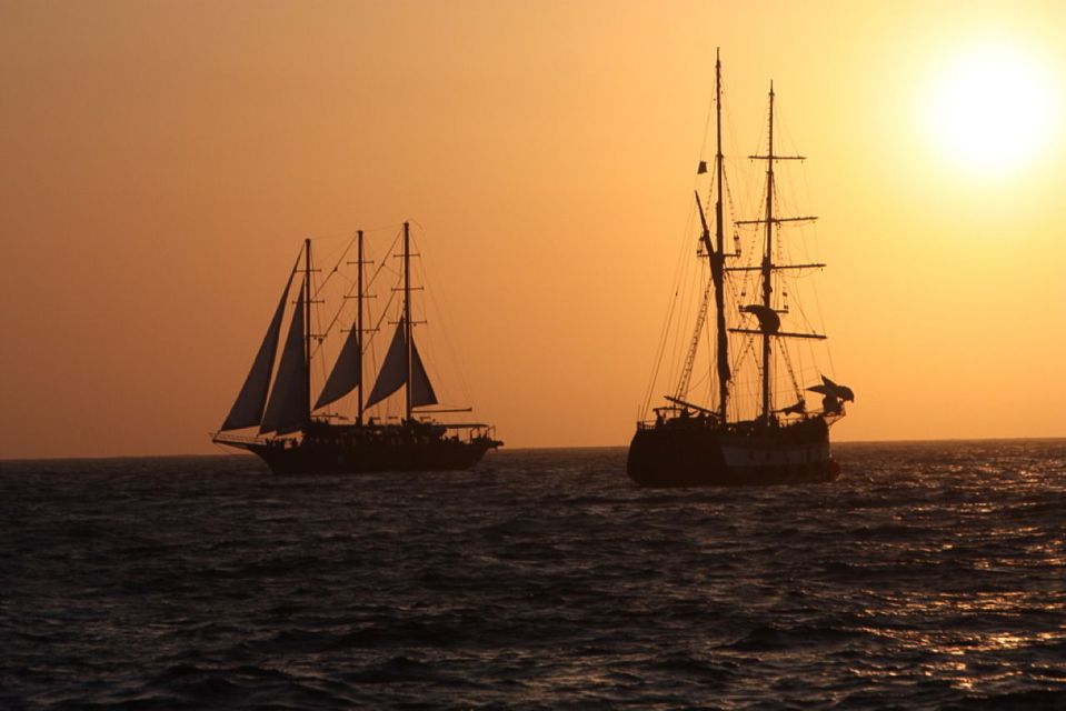 Santorini: Volcanic Sunset Cruise with Dinner - Dinner at Sea: What You Can Expect to Eat