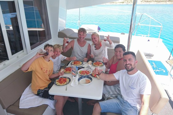 Shared Catamaran All inclusive-Day Cruise to Naxos or Paros - Traditional Lunch on Board: Local Food, Served at Sea
