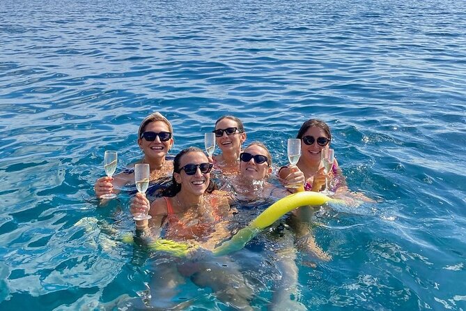 Sicilian wine tasting on the boat in Taormina - Isola Bella: the long swim stop and the color show