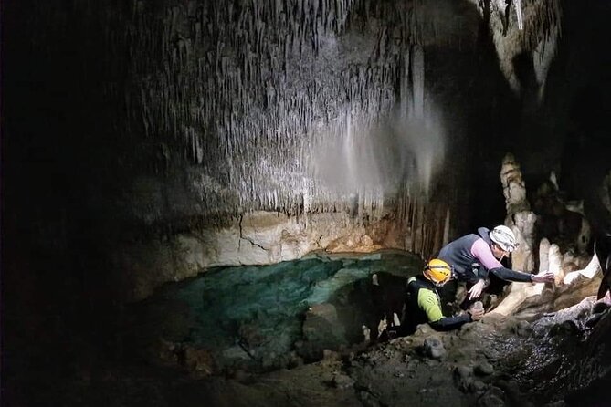 Small-Group Cova de Coloms Sea Caving Tour in Mallorca - Inside Cova de Coloms: underground lakes, mineral color, and that headlamp glow