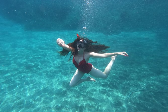 Small-Group Santorini Sea Caves Kayak Trip with Snorkeling & Picnic - White Beach and Cliff Jumping: The Adrenaline Stop