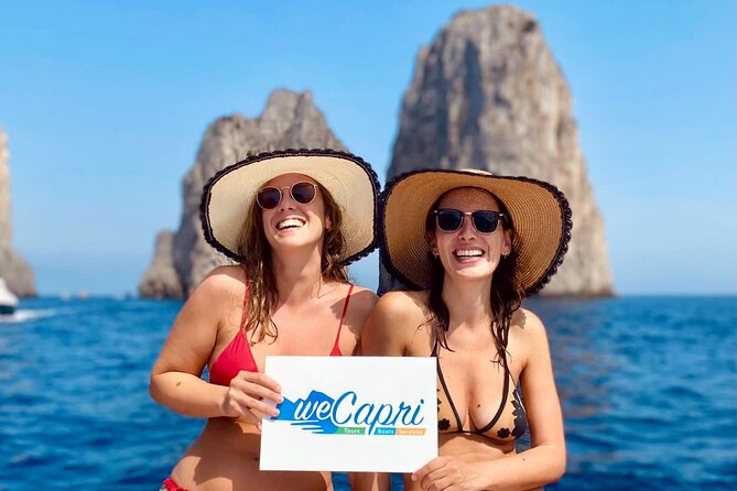 Sunset & Aperitif Boat tour - Faraglioni at sunset: the first iconic rock views and cave passes