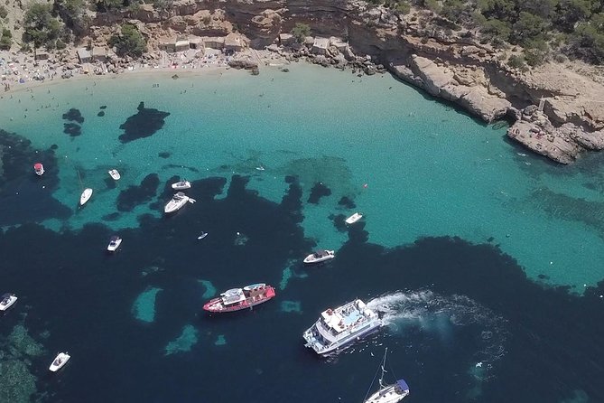 Sunset Beach Hopping Cruise, Cala Comte and Cala Bassa, SUP and snorkelling - The included swim stop: slides, paddleboard time, and snorkeling
