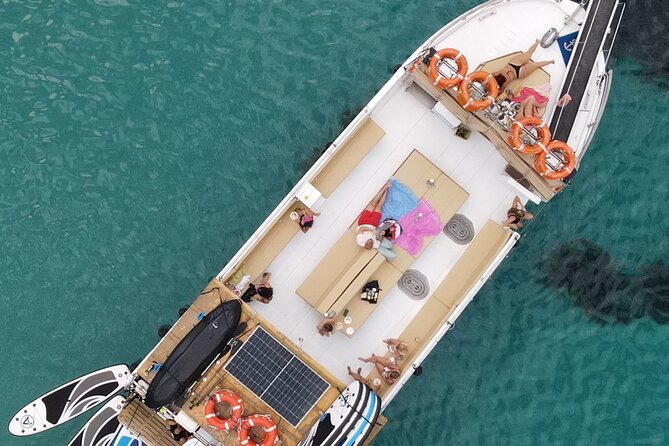 Sunset Boat Tour in Ibiza with All Inclusive - Cala Bassa or Cala Conta: the swim stop that makes or breaks the day