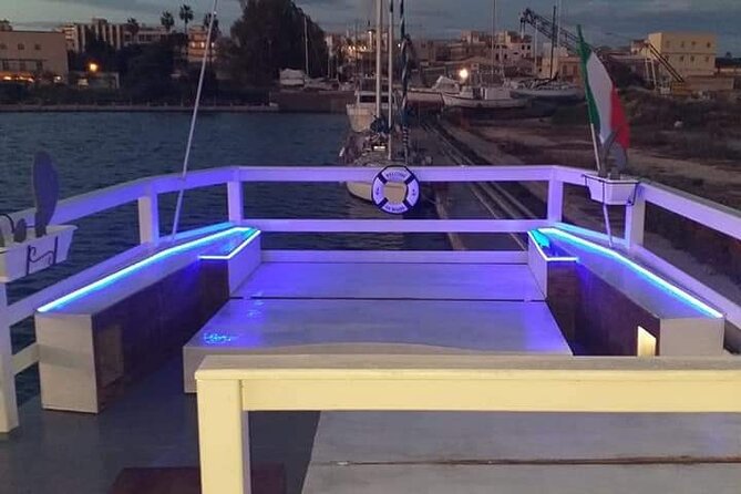 Sunset boat tour with aperitif and swimming break - The Castello Maniace pass-by: sunset lighting you can actually enjoy