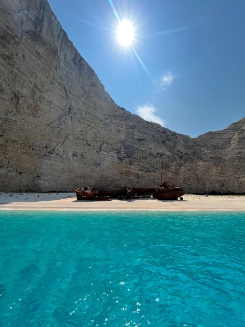 Zakynthos: Glass-Bottom Boat to Navagio, Caves & White Beach - Old Olive Tree stop: tastings, shopping, and a breather on land